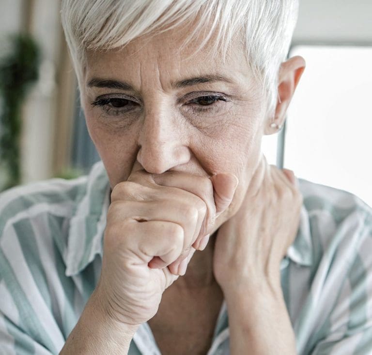 older woman coughing - fungal landscape therapeutic crisis